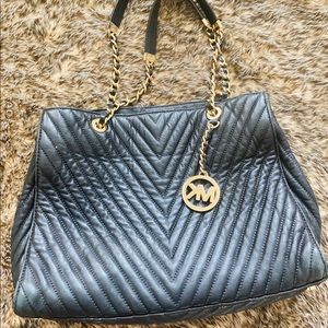 Black handbag with gold accents